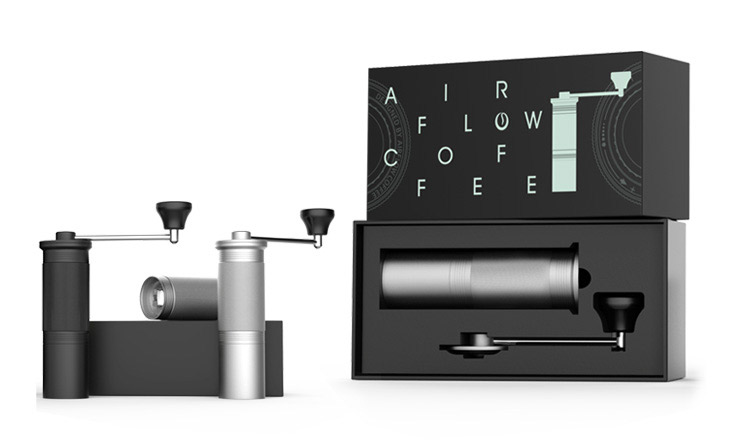 Airflow gooseneck kettle pouring into a glass coffee dripper